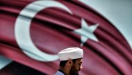 A man passes the Turkish at the Sarachane park in Istanbul on July 19, 2016. AFP