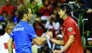 Richard Gasquet of France (left) is congraturated by Taro Daniel of Japan after their Davis Cup world group first round match in Tokyo yesterday. 