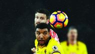 Watford's Troy Deeney in action with Arsenal's Shkodran Mustafi during the English Premier League at the Emirates Stadium on Tuesday.