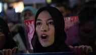 A girl chants as the Astoria community stands together with Muslim-Americans and Muslim immigrants at a rally, February 3, 2017 in New York. / AFP / Bryan R. Smith

