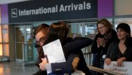 Behnam Partopour, a Worcester Polytechnic Institute (WPI) student from Iran, is greeted by his sister Bahar (L) at Logan Airport after he cleared U.S. REUTERS/Brian Snyder
