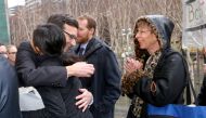 Washington state Attorney General Bob Ferguson hugs people outside the courthouse after a press conference at the U.S. District Court, Western Washington, on February 3, 2017 in Seattle, Washington. Karen Ducey/AFP