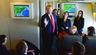 US President Donald Trump chats with reporters on board Air Force One before departing from Andrews Air Force Base in Maryland, bound for Palm Beach, Florida on February 3, 2017. (AFP / MANDEL NGAN)