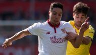 Sevilla's French forward Samir Nasri (L) vies with Villarreal's midfielder Manuel Trigueros during the Spanish league football match Sevilla FC vs Villarreal CF at the Ramon Sanchez Pizjuan stadium in Sevilla on February 5, 2017. / AFP / JORGE GUERRERO