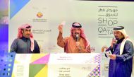 Officials declare the winner at the raffle draw on the concluding day of Shop Qatar festival, yesterday. Pic Abdul Basit / The Peninsula