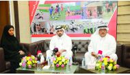 Ali Al Hitmi (right), Secretary General of the Qatar School Sports Association (QSSA) announcing details about the Schools Olympic Program at a press conference in the presence of Abdulrahamn Al Muftah, the Executive Director of QSSA, and Fajar Al Kubesi,