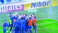A TV grab of Bunyodkor players celebrating their win over Qatar’s El Jaish in Doha yesterday. The visitors won 3-1 in a penalty shoot-out to book a place in the AFC Champions League Group Stage.
