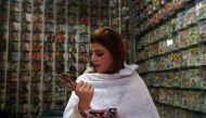 Malala Gul, a local singer, looks to buy music CDs at a shop in Peshawar, Pakistan, January, 28, 2017. Reuters/Fayaz Aziz
