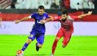 Al Rayyan’s Rodrigo Tabata (left) and Lekhwiya’s Ahmed Yasser Aziz vie for ball possession during their Qatar Star League (QSL) match at Lekhwiya Stadium in this November 2015 file photo.