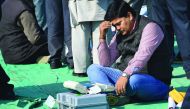 An election official checks an Electronic Voting Machines at a distribution centre in Ghaziabad yesterday.
