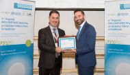 Dr Mohammed Hassan Kharita presents a certificate to  Rabih Wafiq Hammoud of HMC’s OHS Department.