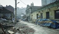 Derelict buildings stand in a neighbourhood that is slated for demolition and redevelopment in Dalian, China.