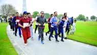 Minister of Culture and Sports, H E Salah bin Ghanem Al Ali, participating in the National Sport Day celebrations at Aspire Park, yesterday.    Pictures: Baher Amin / The Peninsula