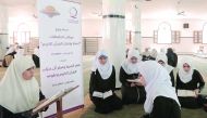 Girls and women participating at a Holy Quran reciting and memorising programme organised by Qatar Charity in Gaza.