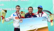 Podium winners of the event, (from left) Nikita Egorov, Wallace and Hamad Alkendi pose for a photograph during an event after Qatar Open Shotgun championship at the Losail Shooting Range yesterday.   