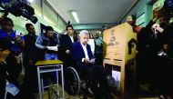 Ecuadorean presidential candidate of the Alianza PAIS party, Lenin Moreno (centre), votes at a polling station in Quito, yesterday.