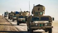 Iraqi tanks and armoured vehicles advance towards the village of Sheikh Younis, after the offensive to retake the western side of Mosul commenced on February 19, 2017. / AFP.