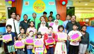 'Lulu Creative Club' contest winners and participants. Below: A member being honoured. 