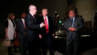 U.S. President Donald Trump (C) views an exhibit on slavery during the American revolution while visiting the National Museum of African American History and Culture in Washington, U.S., February 21, 2017. REUTERS/Jonathan Ernst