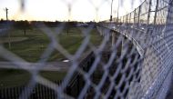 View of metal fence from international bridge between Mexico and US on February 21, 2017 in Piedras Negras, Coahuila state, northern Mexico. AFP / YURI CORTEZ