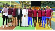 Mohammed Al Fadalah (centre) Director of Public Relations and Media Department at Qatar Olympic Committee and Dr Hazem Fareed, (fourth left) Deputy Sports Director at Aspire Academy, pose for a photograph with members of the Brazilian athletes during the 