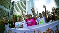Students holding an anti-government protest to mark the third anniversary since the killing of student protester Bassil da Costa by security forces during weeks of unrest in Caracas.