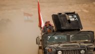 A displaced elderly Iraqi man who just fled his home arrives on military humvee at Sepcial forces base , as Iraqi forces battle with Islamic State militants, in western Mosul, Iraq February 27, 2017. REUTERS/Zohra Bensemra
