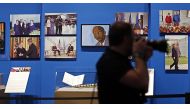 This file photo taken on April 3, 2014 shows paintings by former US President George W. Bush on display with photographs as part of the exhibit, 