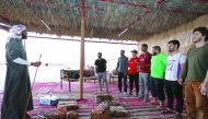 Qatar University students at the Tamkeen Club camp organised by Qatar Charity.