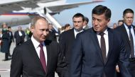Russia's President Vladimir Putin walks with Kyrgyz Prime Minister Sooronbai Zheenbekov upon his arrival at Manas airport outside Bishkek, Kyrgyzstan February 28, 2017. Sputnik/Alexei Nikolsky
