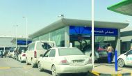 Long queue of cars at a service station in Doha. 