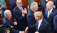 A file photo of Attorney General Jeff Sessions (left) reaching out to shake hands with President Donald Trump after Trump's address to a joint session of Congress in Washington, DC.