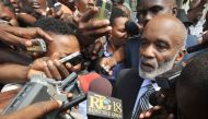(FILES) This file photo taken on March 7, 2013 shows Former haitian president Rene Preval speaks to the press March 7, 2013 after giving testimony in court regarding the assassination Haitian journalist Jean Dominique in Port-au-Prince.  AFP / Thony BELIZ