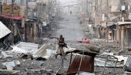  An Iraqi special forces soldier runs across a street during a battle with Islamic State militants in Mosul, Iraq March 3, 2017 REUTERS/Goran Tomasevic 