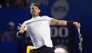 Spanish tennis player Rafael Nadal returns the ball to Marin Cilic of Croatia during the semi finals of the ATP Mexican Tennis Open, in Acapulco, Guerrero state, Mexico, yesterday.