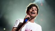 (FILES) This file photo taken on December 1, 2015, shows Singer Louis Tomlinson of musical group One Direction performing onstage during 106. AFP / KEVIN WINTER
