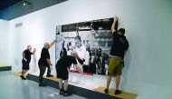 People getting ready for the opening of the retrospective by the celebrated French artist, JR, at QM Gallery in Katara.