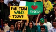 Pakistani spectators hold placards at Gaddafi Cricket Stadium as they wait for the start of a hugely anticipated finals of its domestic cricket league, Pakistan Super League (PSL) in Lahore, Pakistan, March 5, 2017. (REUTERS/Faisal Mahmood)