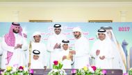 President of Qatar Olympic Committee (QOC) H E Sheikh Joaan bin Hamad Al Thani poses for a photograph with the winners of the annual festival of Arabian Thoroughbred Camel Race for the Sword of the Emir 
H H Sheikh Tamim bin Hamad Al Thani during the pre