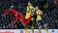 Liverpool's German-born Cameroonian defender Joel Matip (L) tries to reach the ball during the English Premier League football match between Liverpool and Arsenal at Anfield in Liverpool, north west England on March 4, 2017. AFP / Paul ELLIS 

