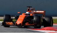 McLaren's Spanish driver Fernando Alonso drives at the Circuit de Catalunya on March 10, 2017 in Montmelo on the outskirts of Barcelona on the fourth day of the second week of tests ahead of the Formula One Grand Prix season. / AFP / LLUIS GENE