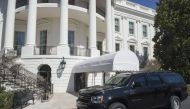 A SUV is parked outside of the South Portico on the South Lawn of the White House in Washington, DC, March 11, 2017. A man carrying a backpack was arrested Friday night after breaching security at the White House complex and was discovered by a Secret Ser