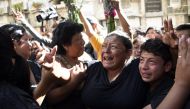 Relatives and friends cry at the funeral of 14-year-old Madelyn Patricia Hernandez Hernandez, who died in a fire at a state-run shelter, at the general cemetery in Guatemala City on March 10, 2017. AFP / Johan Ordonez