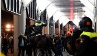 Riot police clash with demonstrators in the streets near the Turkish consulate in Rotterdam, Netherlands March 12, 2017. REUTERS/Dylan Martinez
