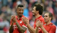 (L to R) Bayern Munich's defender Jerome Boateng, Bayern Munich's defender Mats Hummels and Bayern Munich's defender Philipp Lahm applaud after the German First division Bundesliga football match Bayern Munich vs Eintracht Frankfurt in Munich, southern Ge