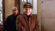 This file photo taken on December 9, 2013 shows International terrorist Ilich Ramirez Sanchez (R), aka Carlos, arriving at the Criminal Court of the Palais de Justice in Paris. Ilich Ramirez Sanchez, a figure of international terrorism in the 70s and 80s,