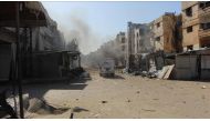 Damaged buildings are seen after war crafts belonging to Syrian army carried out airstrikes over residential areas despite cessation-of-hostilities agreement in Homs, Syria on March 8, 2017. ( Wasim Saduldin - Anadolu Agency ).