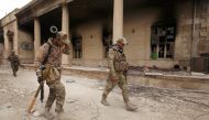 Iraqi rapid response forces carry their weapons during clashes with Islamic State militants in Mosul, Iraq March 13, 2017. Picture taken March 13, 2017. REUTERS/Azad Lashkari
