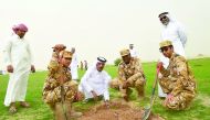 Officials planting the trees as part of Tree Week activities.
