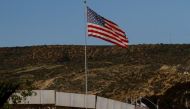 A US flag seen next to a section of the wall separating Mexico and the United States, in Tijuana, Mexico. Reuters/Jorge Duenes
